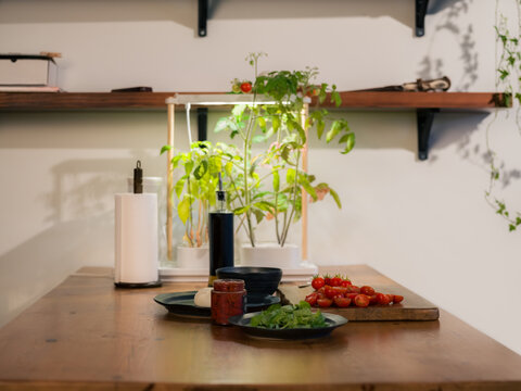 Fresh salad ingredients on table at home 