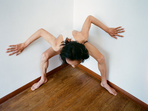 Person Pressing Against the Corner of a Room