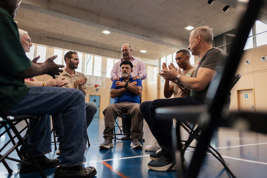 Group of diverse men participating in support session