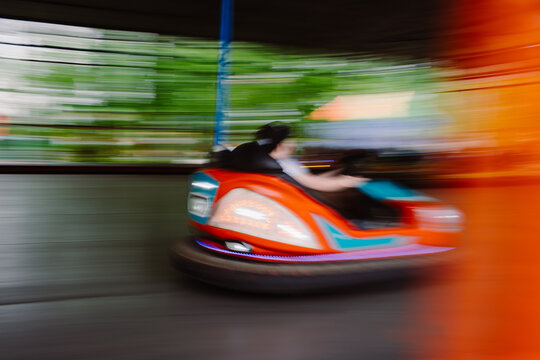Blurred bumper car ride at amusement park