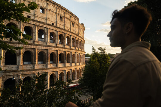 Silhouette of a traveler with the Colosseum in Rome