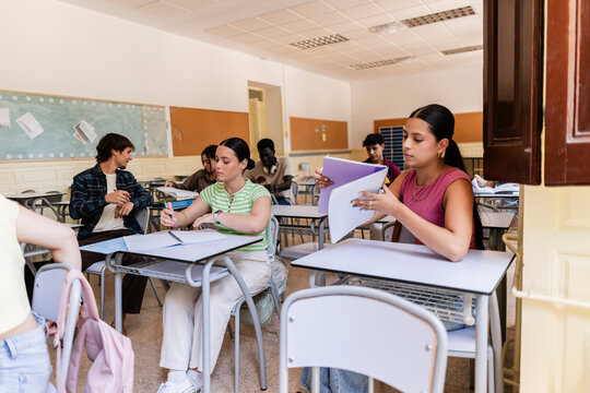 Young diverse students learning studying in a classroom