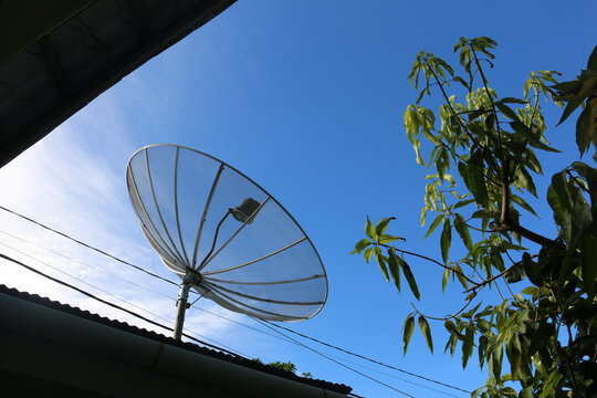 Large Satellite Dish Antenna Against Clear Blue Sky for Telecommunication and Wireless Communication