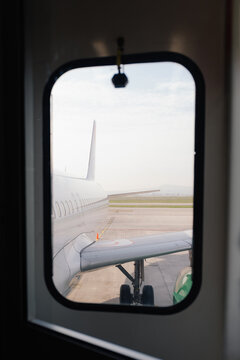 Airplane view through airport window