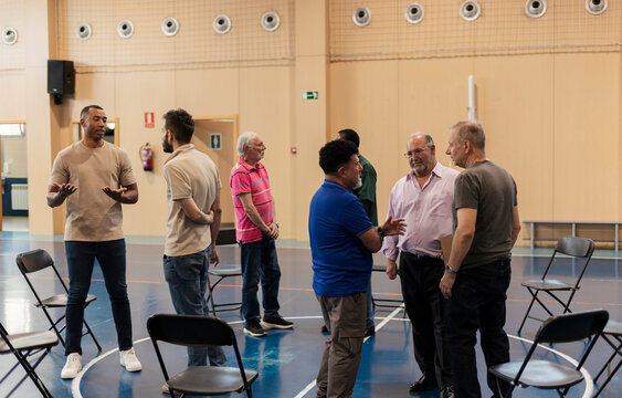 Diverse men discussing in a group meeting activity