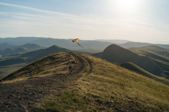  Little girl with flying kite