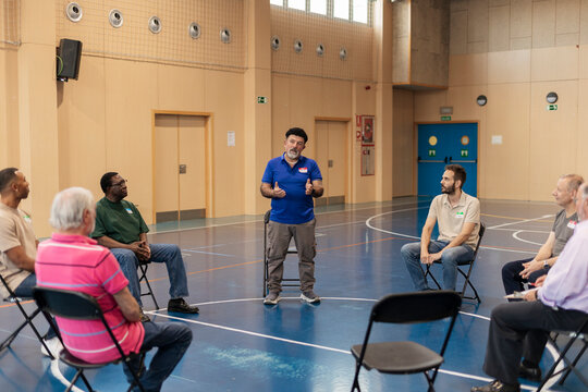Diverse men involved in support group discussion