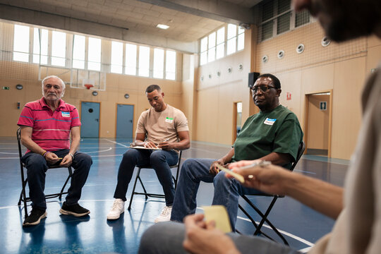 Diverse men participating in community support group