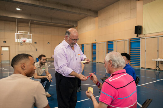 Group of diverse men participating in workshop activity