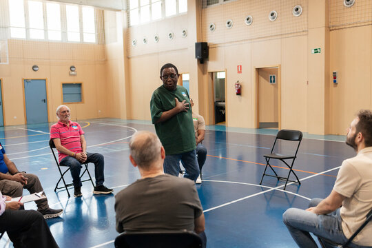 Diverse men participating in a group therapy session