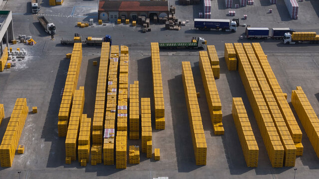 Pontenure, Italy - 30 March 2026: Aerial view of rows of yellow-packaged YTONG concrete blocks stacked in the yard of the Xella Italia manufacturing facility.