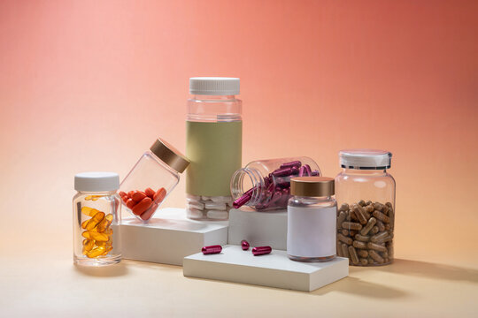 Assortment of vitamin and supplement bottles with various capsules
