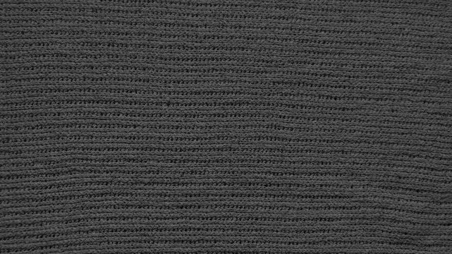 charcoal knit fabric texture background with cozy wool stitches inspiring winter web design and advertising backdrops