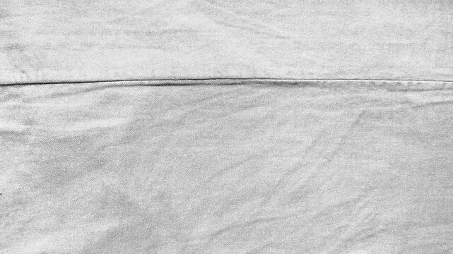 white fabric texture with diagonal cotton weave and soft horizontal seam for serene minimalist web design and branding