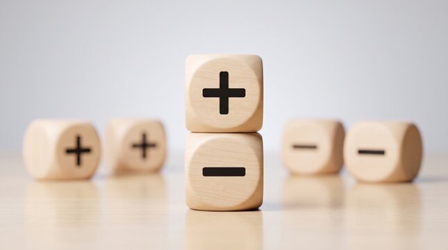 Wooden cubes with plus and minus signs on a table with subtraction calculation business addition strategy planning solution finance symbols with desktop