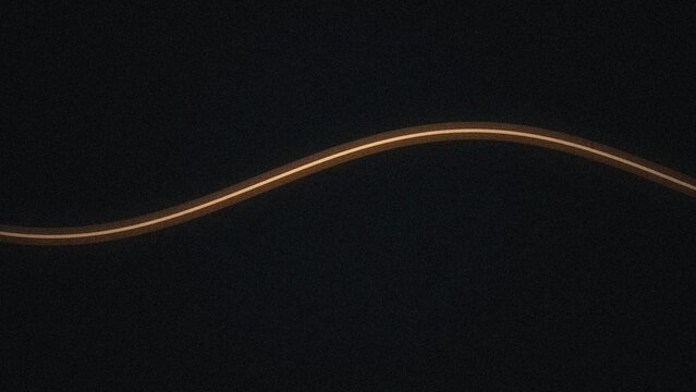 A single glowing orange light trail forming a gentle horizontal sine wave curve across a dark textured background, with subtle grain