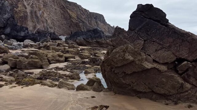 Low tide on a secluded rocky part of Sandymouth Bay beach in Cornwall