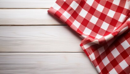 Obraz premium red checkered picnic tablecloth on white wood table