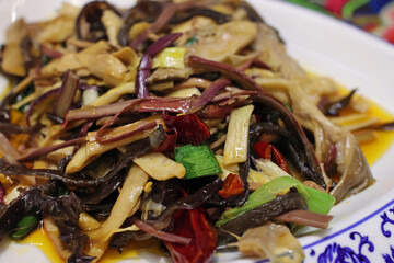Fototapeta premium Stir-fried black fungus, bamboo shoot and mushroom served in a restaurant at Fenghuang County, Hunan Province of China