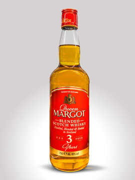 Italy - August 14, 2026: 70cl bottle of Queen Margot 3 Years Old Blended Scotch Whisky against a clean, light grey gradient background. 