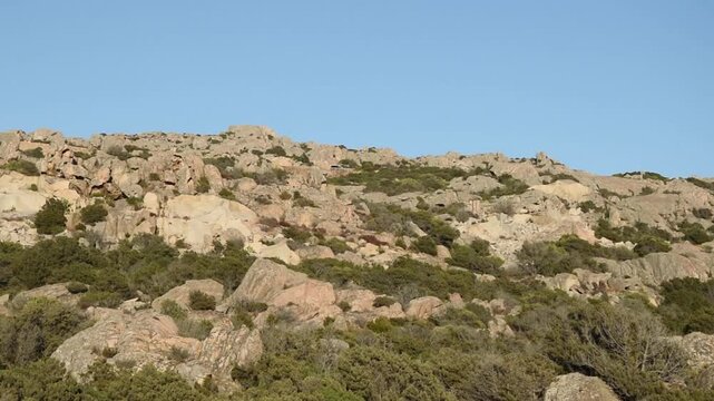 View of the granite rocky landscape of La Maddalena Island at sunset, Sardinia, Italy.