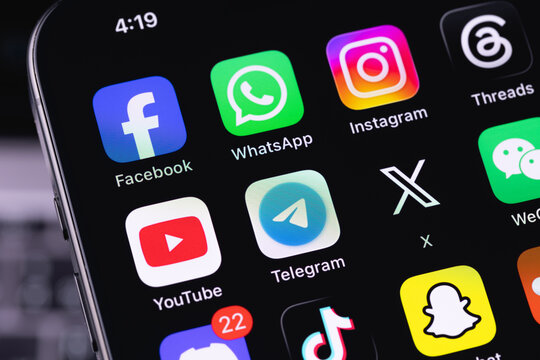 smartphone iPhone with mobile icon apps Facebook, WhatsApp, Instagram, Threads, YouTube, Telegram, X, TikTok. Most popular social media platform. Batumi, Georgia - June 17, 2026