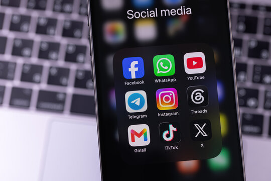 smartphone iPhone with mobile icon apps Facebook, WhatsApp, YouTube, Telegram, Instagram, Threads, Gmail, X, TikTok. Most popular social media platform. Batumi, Georgia - June 17, 2026