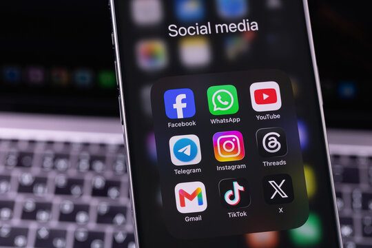 smartphone iPhone with mobile icon apps Facebook, WhatsApp, YouTube, Telegram, Instagram, Threads, X, Gmail, TikTok. Most popular social media platform. Batumi, Georgia - June 17, 2026