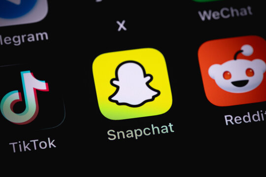 Snapchat logo mobile icon app on a screen smartphone iPhone closeup. Snapchat is a mobile messaging app with attached photos and videos. Batumi, Georgia - June 16, 2026