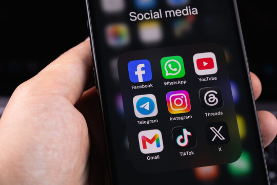 smartphone iPhone with mobile icon apps Facebook, WhatsApp, YouTube, Telegram, Instagram, TikTok, Threads, X, Gmail. Most popular social media platform. Batumi, Georgia - June 17, 2026