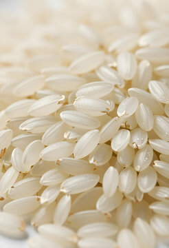Uncooked white rice grains close up, healthy eating and staple food ingredient, Agriculture and harvest