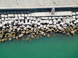 Concrete breakwater blocks protecting coast in cadiz, spain © Tororio Stock