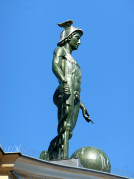 Groningen, the Netherlands - August 9 2026 - A zinc statue of Mercury stands on the roof of the Korenbeurs. He is made by Philip Enthoven around 1867
