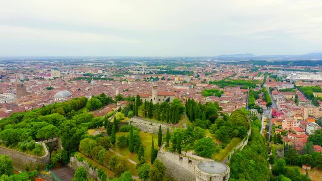 Brescia, Italy. Castello di Brescia. Flight over the city in cloudy weather. Drone footage, Point of interest