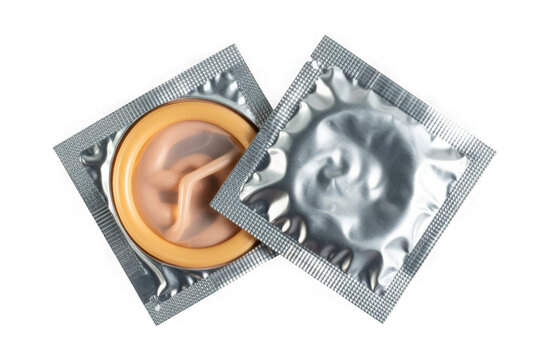 Two opened condom packs showcasing individually wrapped condoms ready for use