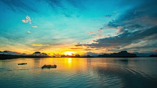 Breathtaking seascape featuring dramatic sunset clouds above tropical islands, with vibrant colors reflected across calm ocean water in a peaceful natural landscape.  Beautiful image idea for travel