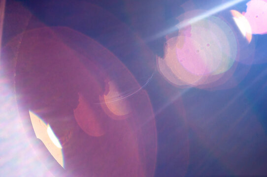 Abstract retro neon light leaks background, anamorphic purple lens flare texture