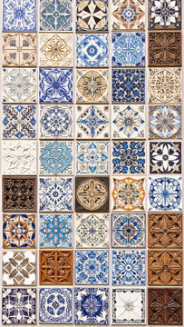 Collection of decorative ceramic tiles with intricate patterns and textures, overhead view