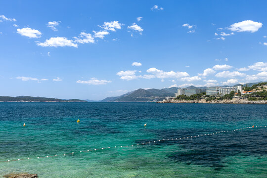 Visitors enjoy summer in Dubrovnik, Croatia with clear waters and sunny skies