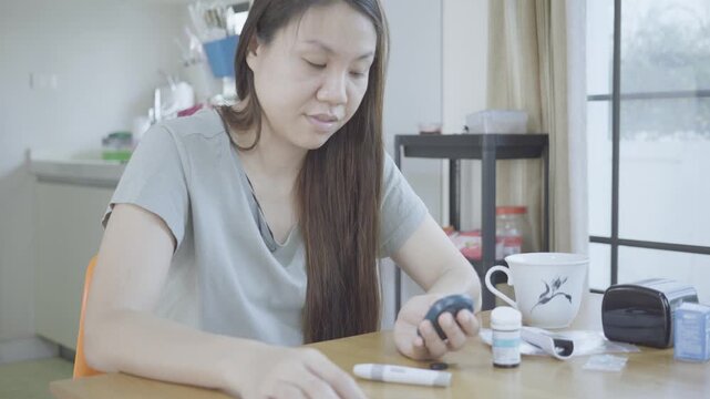 A serene indoor setting featuring an individual examining health-related tools. The image conveys a sense of personal care and attention to health management in a comfortable environment.