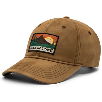 Brown baseball cap with mountain landscape patch and leave no trace text isolated on white background
