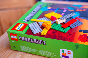 Fototapeta premium LEGO Minecraft box, multicolored plastic bricks, Colorful toy set, building blocks, development fine motor skills, play time, creative activity product detail, brand identity, creating something new