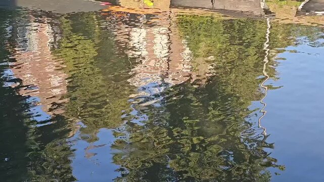Utrecht water canal reflections throught wind at morning light netherland, background transition