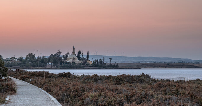 The famous Hala Sultan Tekke, as seen at sunset, also known as the Mosque of Umm Haram, is one of the most significant Islamic monuments in the world. The Mosque is located on the west bank of Larnaca