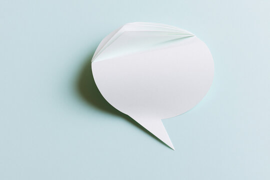 Speech bubble folded from paper communication and dialogue concept