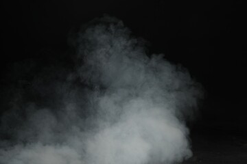Fototapeta premium Beautiful smoke in light on dark background