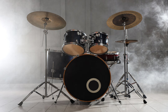 Drum set in studio with smoke. Musical instrument