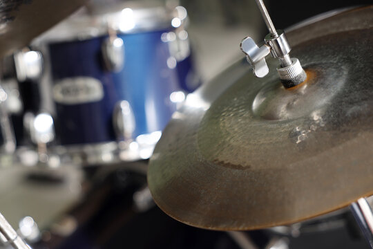 Closeup view of drum set on dark background