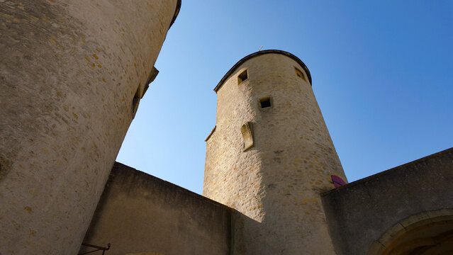Porte des Allemands, a medieval bridge castle, standing against a clear blue sky