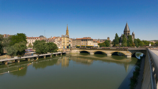 Metz city skyline and Temple Neuf reflecting in the Moselle River